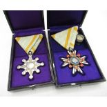 Two cased Japanese WWII period medals comprising of Sacred Treasure Sixth Class and Sacred