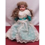 Gebruder Kuhlenz 170K 238 bisque headed doll with curly blonde wig and teal satin dress with lace