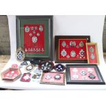 Good collection of British police cap badges and helmet badges, mostly mounted and framed with