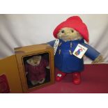 Paddington Bear soft toy by rainbow designs H48cm, and a boxed Paddington bear with UK passport,