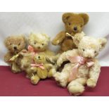 Collection of Merrythought teddy bears including a pink mohair bear with pink ribbon, a blonde