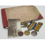 WWI pair awarded to 780589 GNR.E. Heard R. A with associated cap badge and service tag, photographic