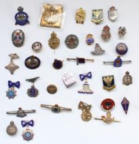 Selection of enamel regimental, sweetheart and civilian association badges, many hallmarked