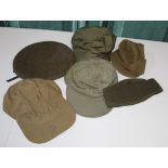 Two General purpose caps, a wooly jeep cap, a Flying cap with leather sweat band, British Beret, WW2
