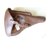 Luger leather holster with magazine pocket, buckle fastener and belt loops