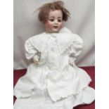 Alt Beck & Gottschalk bisque headed doll, stamped 1361/50 15, wearing short brown wig, white coat