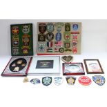 Collection of world police badges and patches including Canadian Mounties, Hong Kong Narcotics