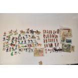 Collection of Britain's Deetail toy soldiers, cowboys, Indians, etc, football cards, three Brook