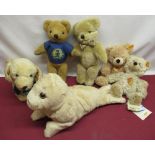 Collection of teddy bears including a Merrythought seal and Labrador, a Burberry bear with check