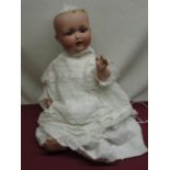 Armand Marseille Koppelsdorf 1330 A 12 M bisque headed doll wearing a christening gown with lace