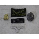 Collection of three German badges and two embroidered clothing labels