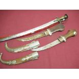 Indian tulwar type sword with scabbard, two large Indo Persian daggars with carved wood handles,