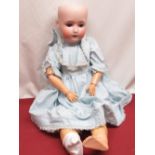 Alt Beck & Gottschalk bisque headed doll, stamped 1362 3 11, with pierced ears, wearing blue spotted