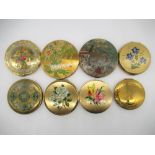 Three Stratton compacts with printed floral pattern on brushed metal ground, Le Rage compact with