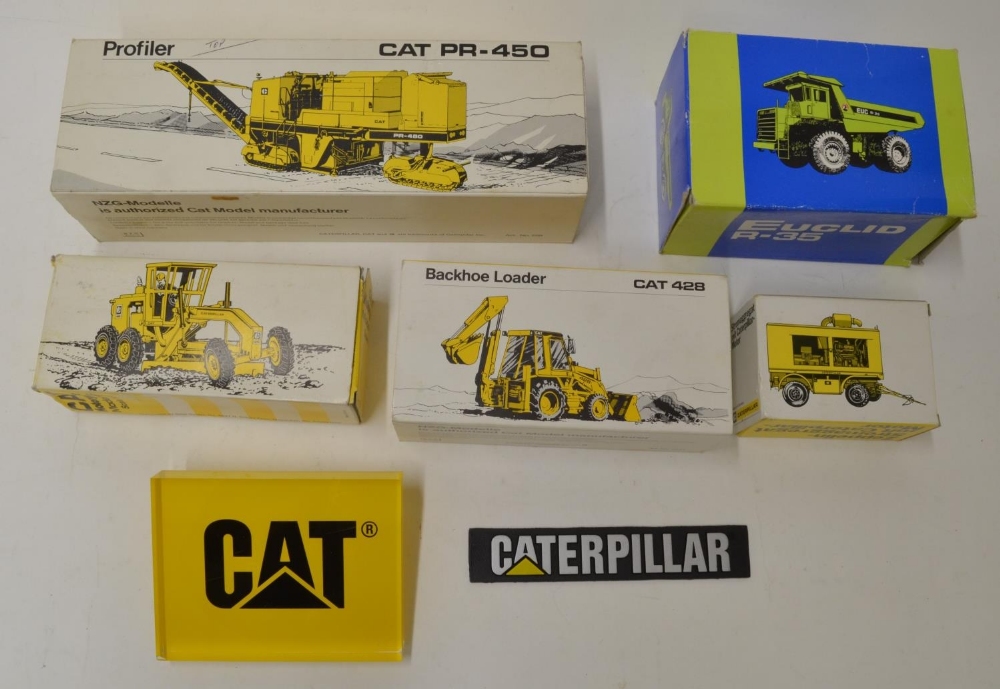 Boxed industrial machinery models, mostly Caterpillar, four by NZG Modelle including PR450