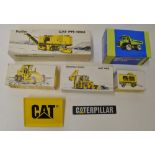 Boxed industrial machinery models, mostly Caterpillar, four by NZG Modelle including PR450