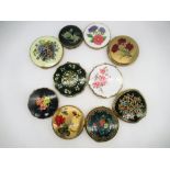 Seven Stratton compacts with floral covers, a Kigu compact with floral cover and two other