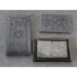 Collection of three cigarette cases including one engraved with a map of India and the Taj Mahal,