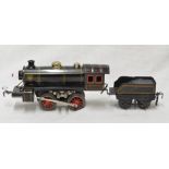Three boxes containing a collection of vintage railway accessories, track, locomotive and tender,