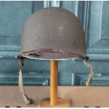 WWI period American M1 steel helmet, complete with liner and webbing