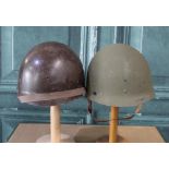 Pair of WWII period M1 helmet liners, complete with webbing