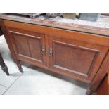 Edwardian oak wash stand, with rouge marble splash back above two doors on turned supports (no