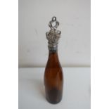 Brown glass wine bottle, the plated mount and stopper cast with fruiting vines (37cm high)