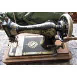 Singer hand operated sewing machine in domed case, School bell with turned wood handle