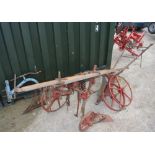 Horsedrawn vintage single plough with spare wheels. A/F