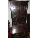 Edwardian mahogany bureau bookcase, two astragal glazed doors above, slope fall front and two