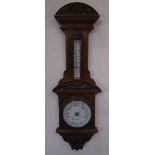 Edwardian aneroid barometer and thermometer, in carved arched top walnut case, signed Lloyd
