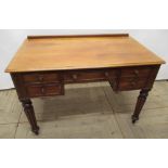 19th century mahogany kneehole writing table, five cockbeaded drawers with turned wooden handles, on