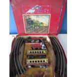 Tinplate reversing battery operated electric train set, in original box with locomotive, tender, two