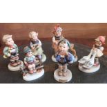 Collection of Hummel and Goebel figures including: Busy Student, Home from Market, Friends, and