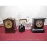 Two glass decanters and two wooden cased mantle clocks
