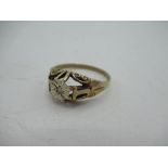9ct yellow gold diamond ring, central round cut diamond inset in a white metal illusion mount,
