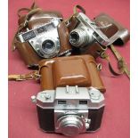 Box of various 35mm vintage cameras including Zeiss Ikon, Kodak, Voigtlander, Agfa etc