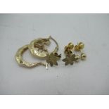Pair of 9ct yellow gold hoop earrings, a 9ct yellow gold circular pendant, yellow gold leaf studs (