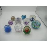 Collection of paperweights of various designs including floral insert, bubble design, apple form