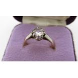 18ct yellow gold diamond solitaire ring, round cut diamond claw set in a platinum mount Size J,