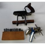 Two vintage plough planes in cast steel. Larger by Stanley with a selection of blades in wooden