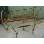 Large vintage sit on grass rake