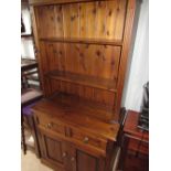 Stained and waxed pine modern dresser, twin shelf back, enclosed by reeded columns, the base with