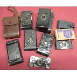 Various miniature folding cameras including Kodak soldiers type compact folding cameras, Ensignette,