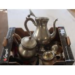 Four piece Royal Holland Pewter tea set and a pair of brass candlesticks with red coloured columns