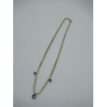 18ct yellow gold box chain necklace with three graduated bezel set blue stones, spring ring clasp