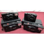 Five Olympus XA2 pocket cameras, some with flash