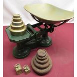 C20th cast iron and brass painted kitchen scales with two sets of graduated weights