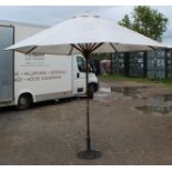 Canvas garden umbrella with pulley system, self standing on cast stand, approx H250cm
