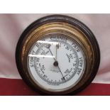 John Barker & Co. Ltd Kensington, early C20th brass cased bulk head aneroid barometer on circular